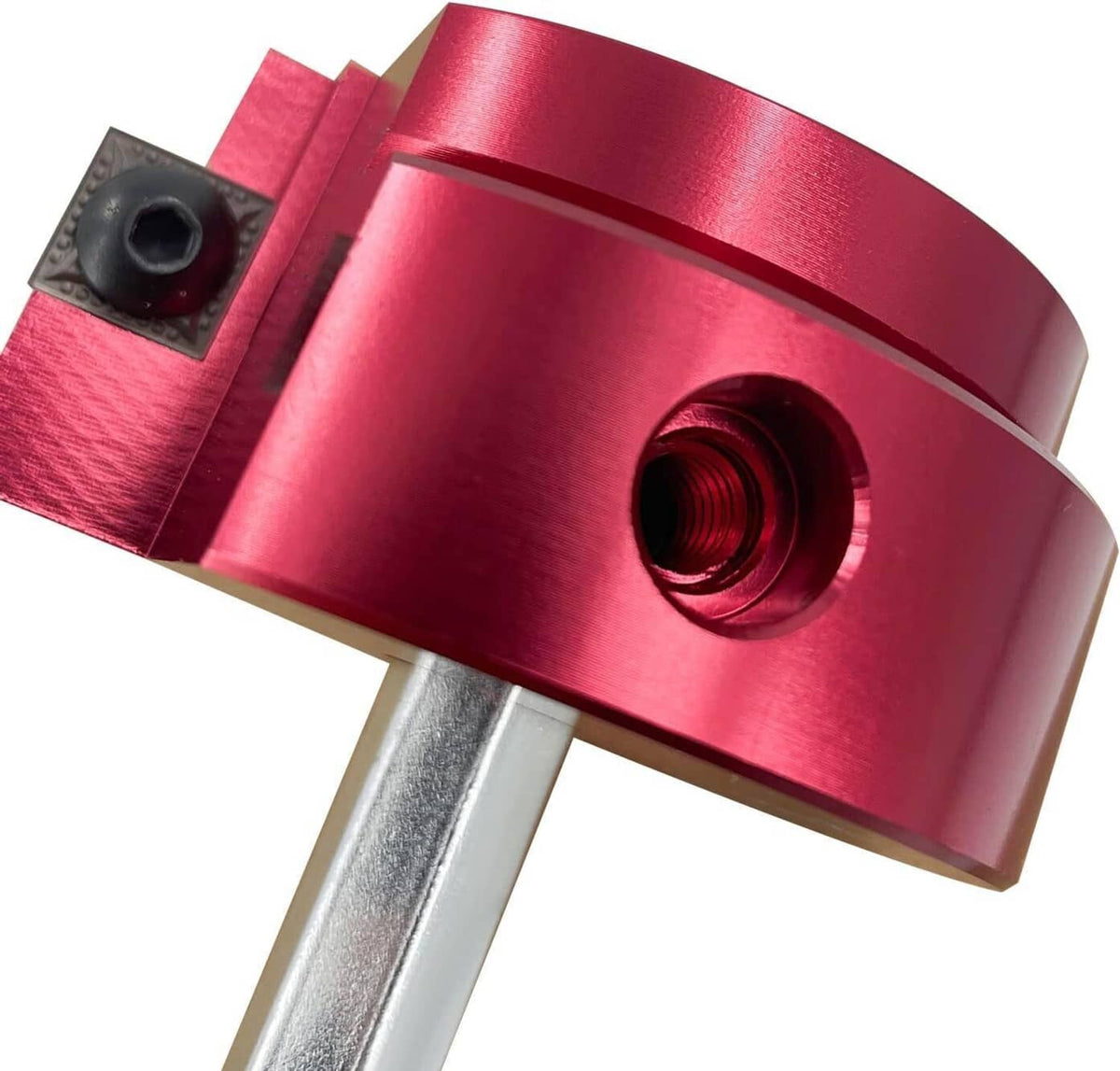 Close-up of red pipe reamer head with threaded opening and cutting insert