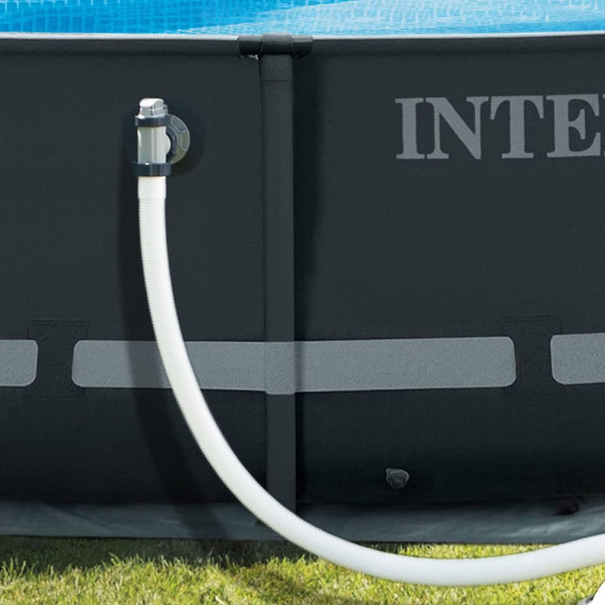 White pump hose connected to inflatable pool inlet fitting