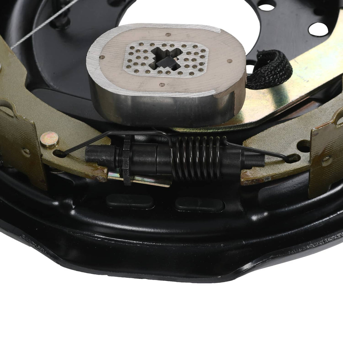 Close-up of actuator and coil spring components inside electric trailer brake