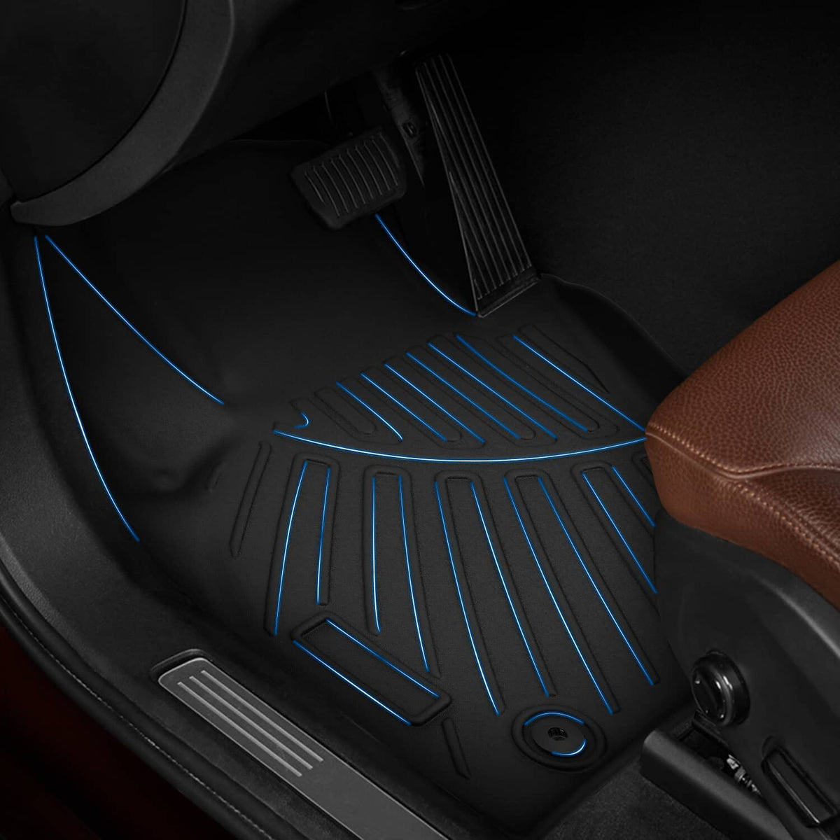 Close-up of black floor mat tread with blue grooves and ridged grip channels