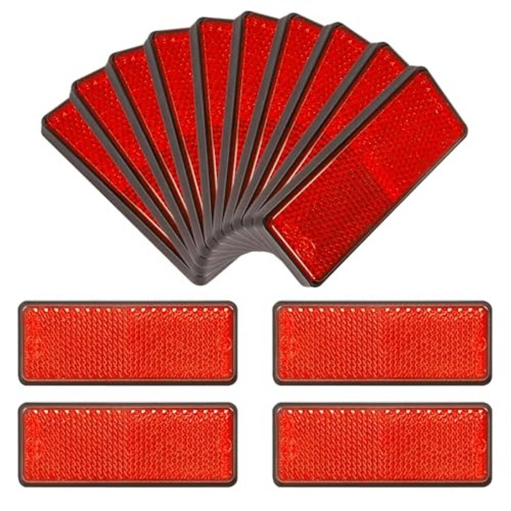 Red reflective road marker set with multiple rectangles and a stacked fan shape