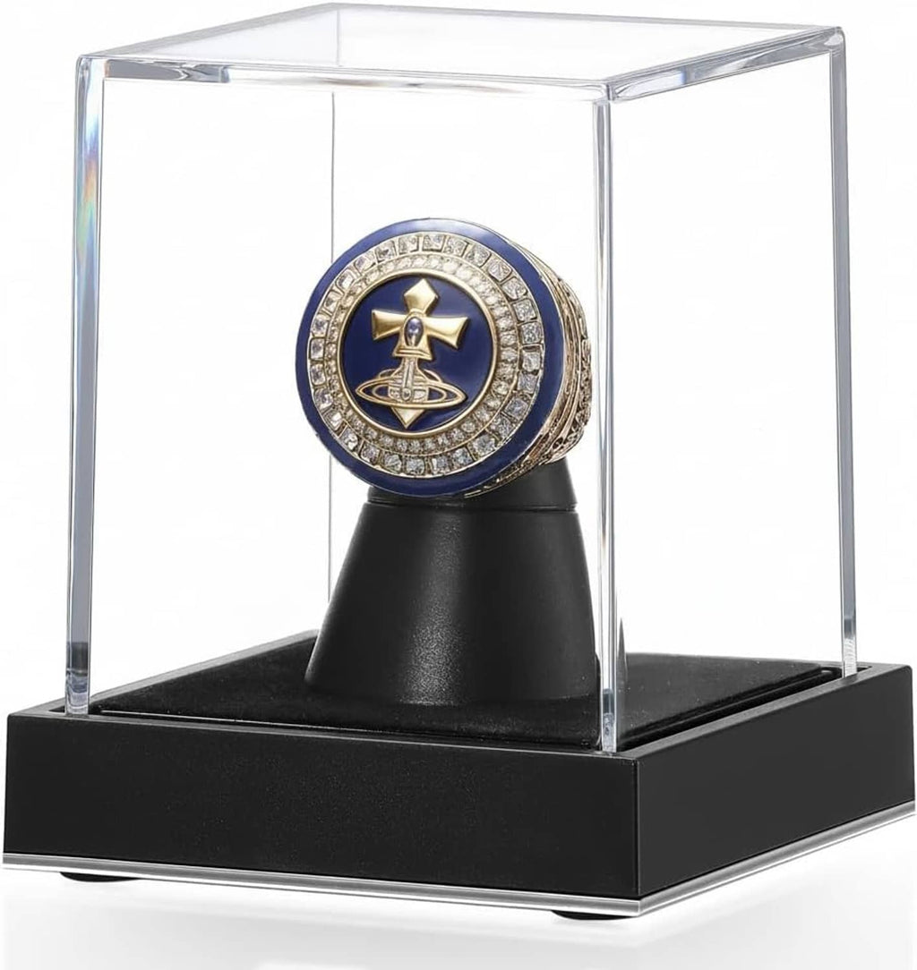 Clear acrylic ring display case with black base and ring holder, featuring a blue-gold ring