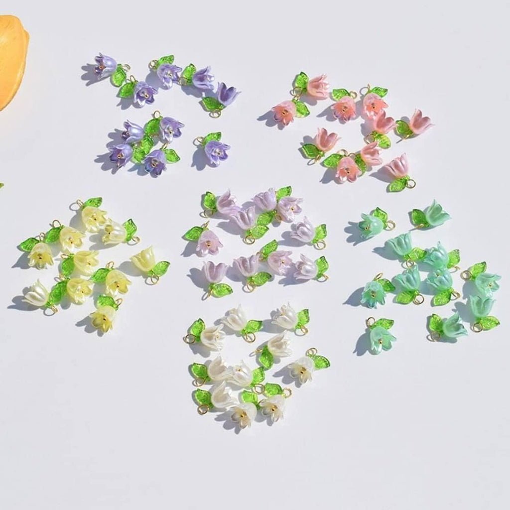 Mixed-color bell flower spacer beads with green leaves and small gold loop rings