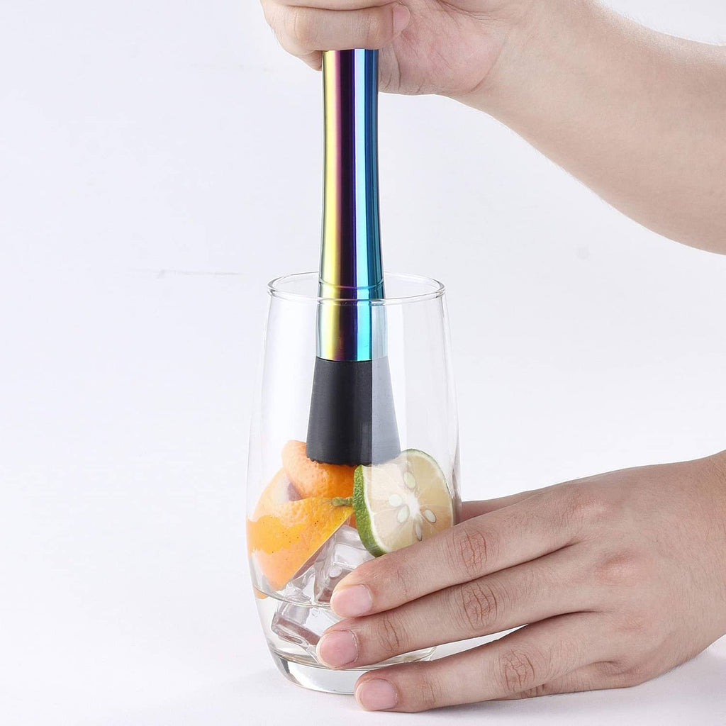 Cocktail muddler held over a glass with ice and citrus slices
