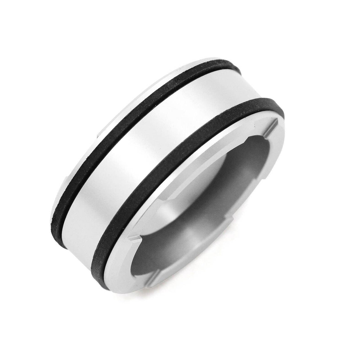 Pinless accumulator piston with black sealing ring and silver metal body, angled view