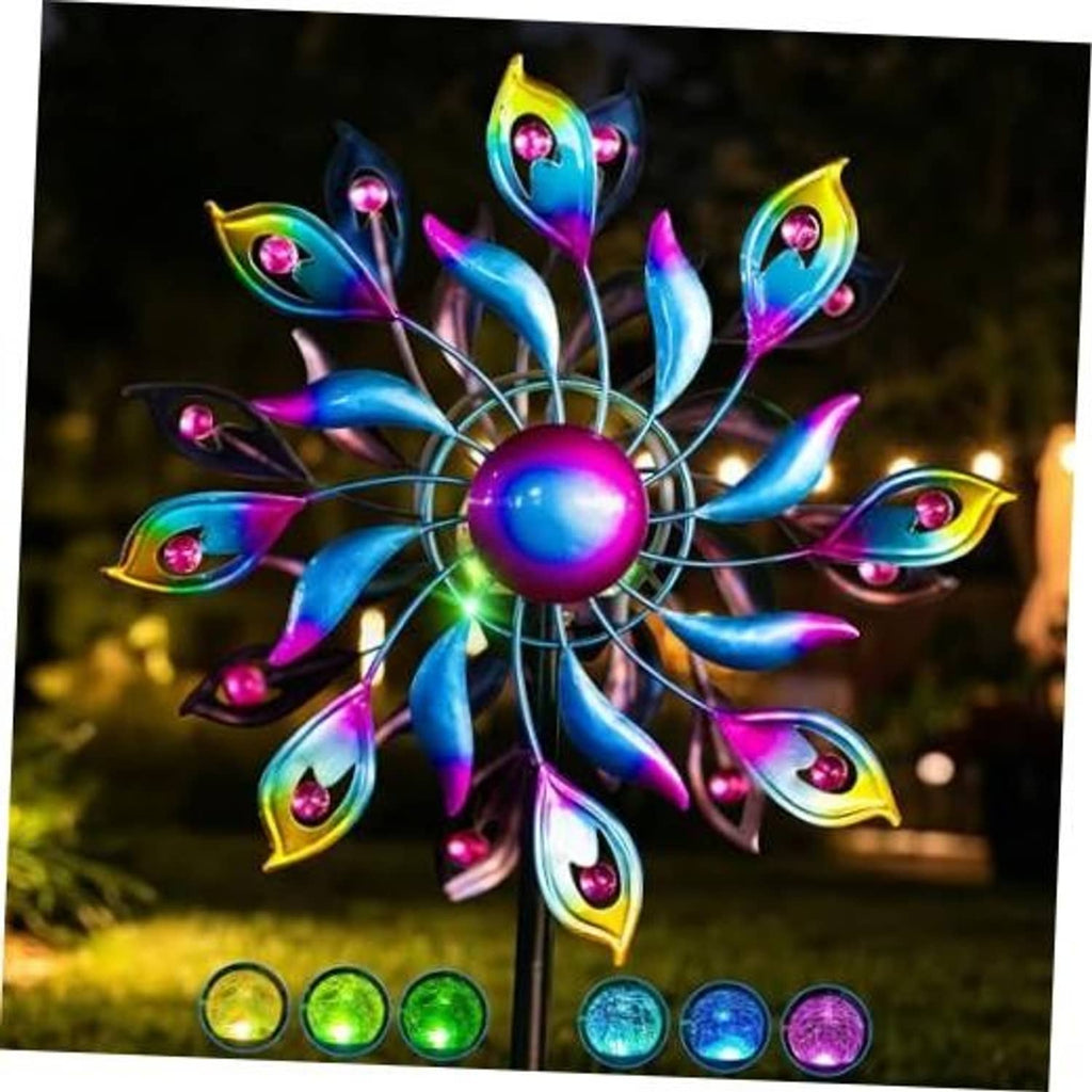 Peacock wind spinner with bright LED bulbs and rainbow metal feather blades on a pole