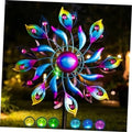 Peacock wind spinner with bright LED bulbs and rainbow metal feather blades on a pole