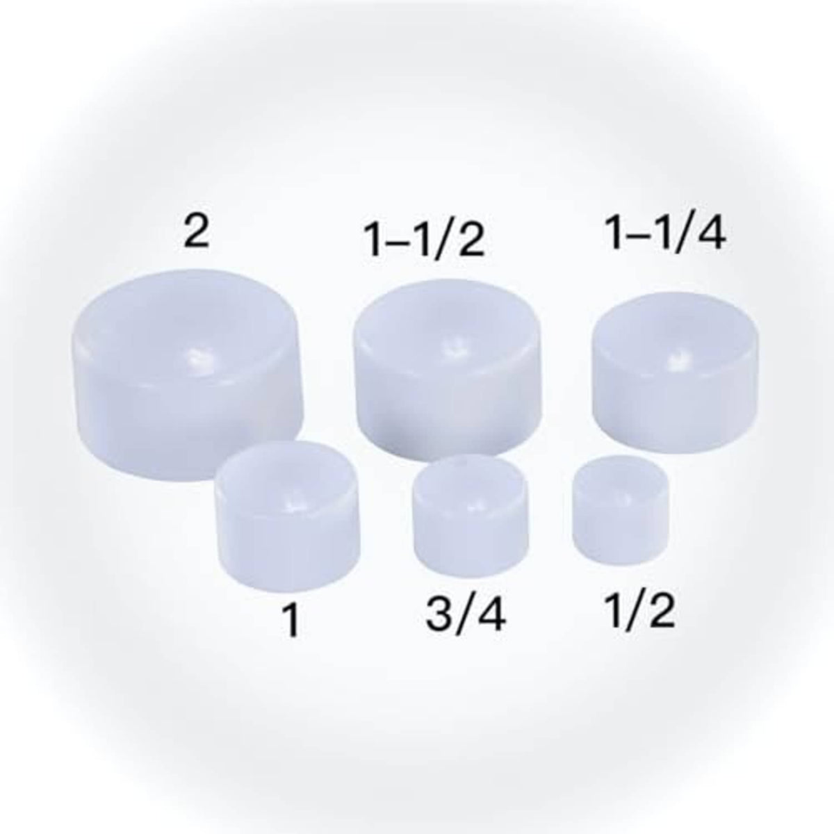 Assorted white PVC schedule 40 end caps labeled by size: 1/2 to 2 in