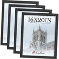 Black 16x20 wood picture frames, 4-pack, stacked with photo inserts