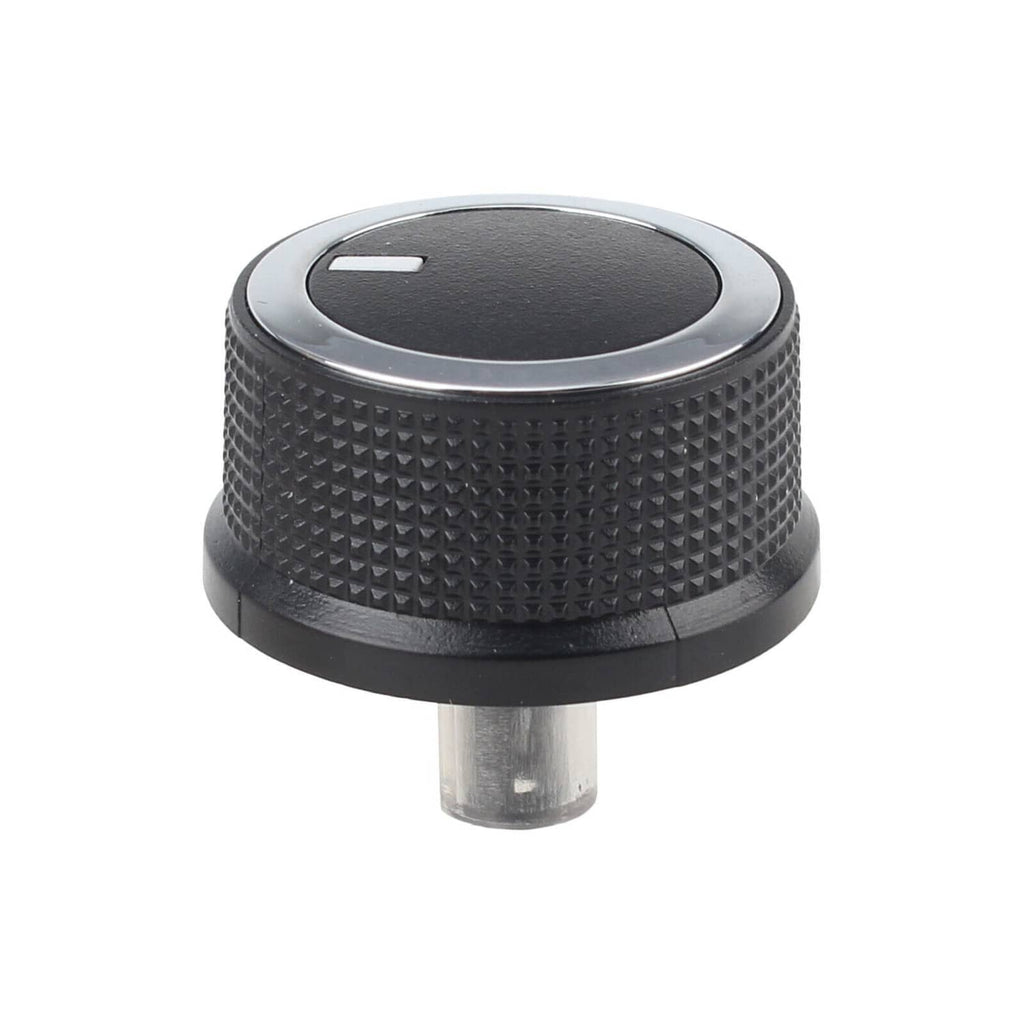 Close-up of black HVAC temperature control knob with silver border and indicator arrow