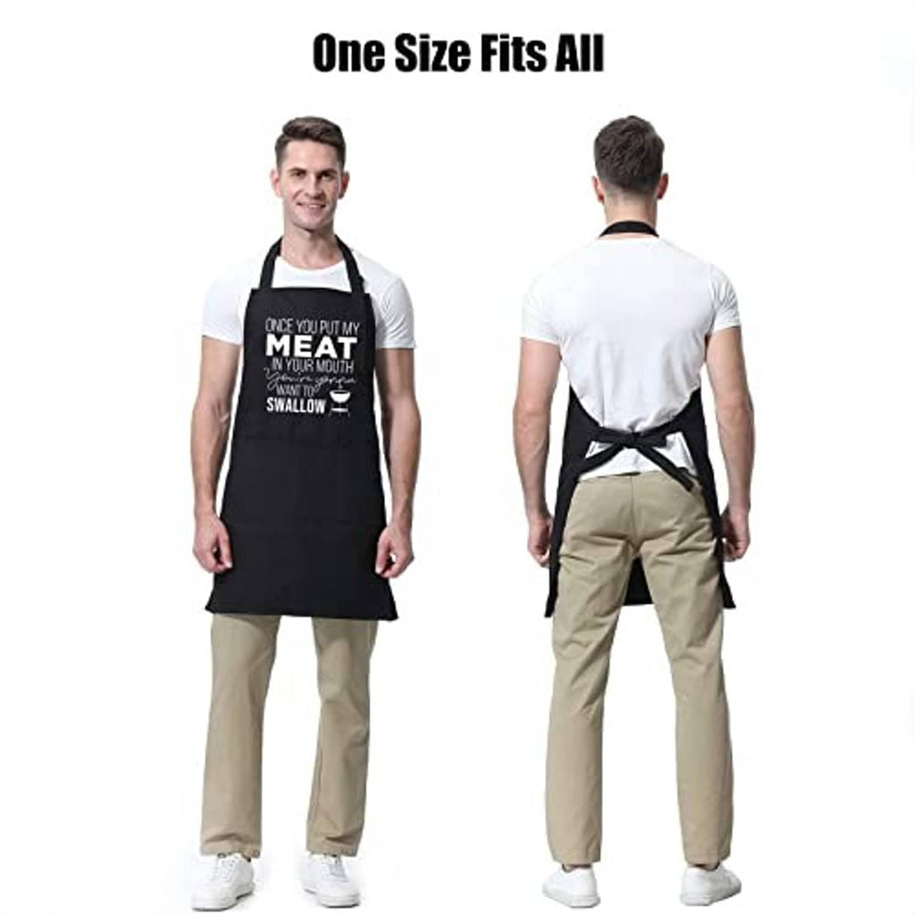 Black cooking apron on a man with long ties and centered "MEAT...SWALLOW" print.
