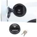 Fuel tank lock cap replacement with black housing and metal keys, shown on vehicle