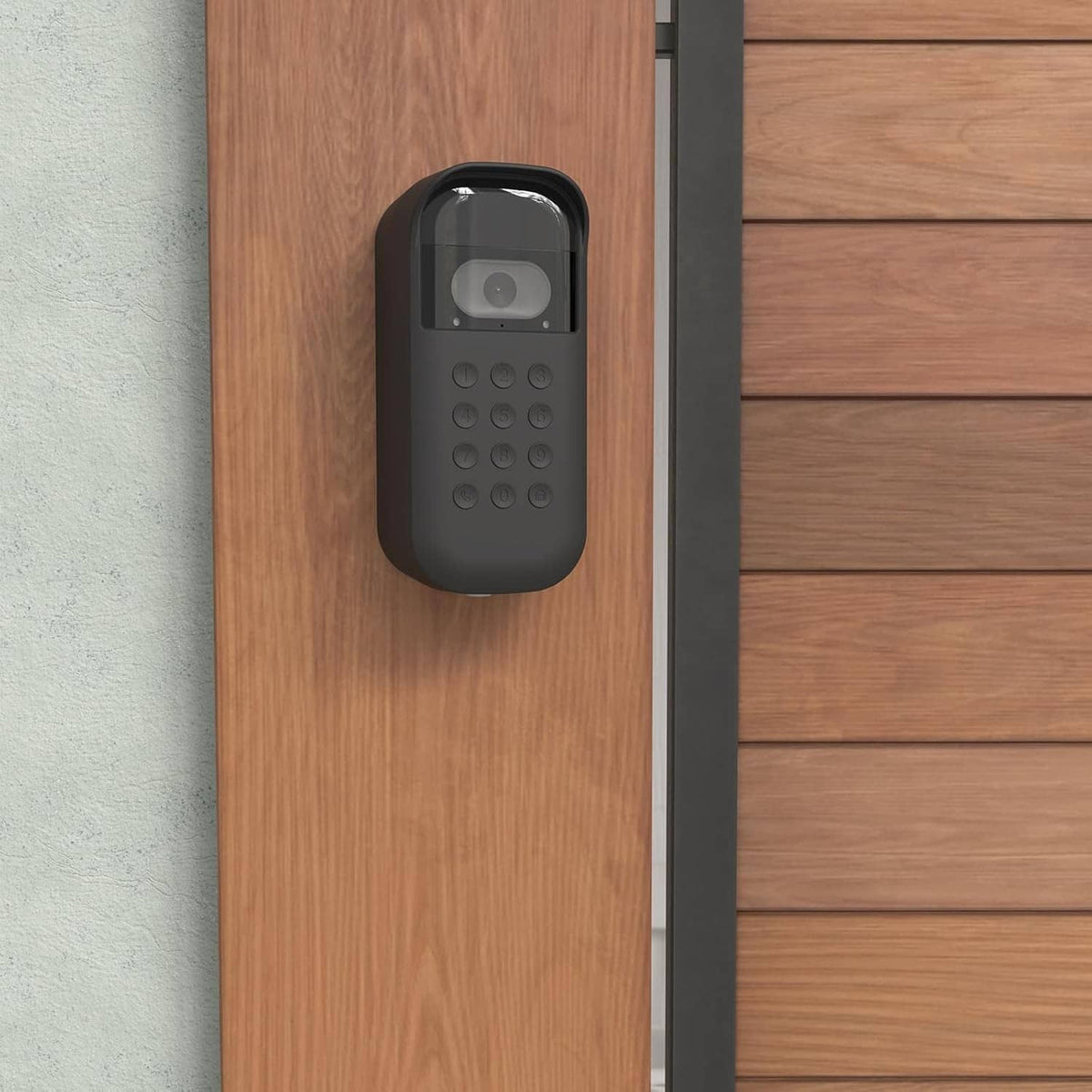 Black silicone camera keypad cover on wooden wall panel