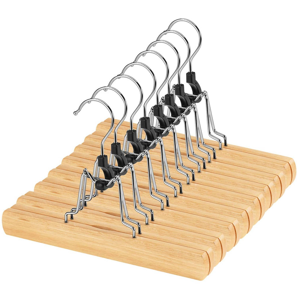 Set of natural wooden pants hangers with metal clips and curved chrome hooks