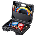 3-way manifold gauge set with two pressure gauges, colored hoses, and fittings in black case