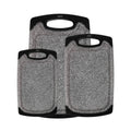 Set of 3 gray speckled plastic cutting boards with black handles and rounded corners