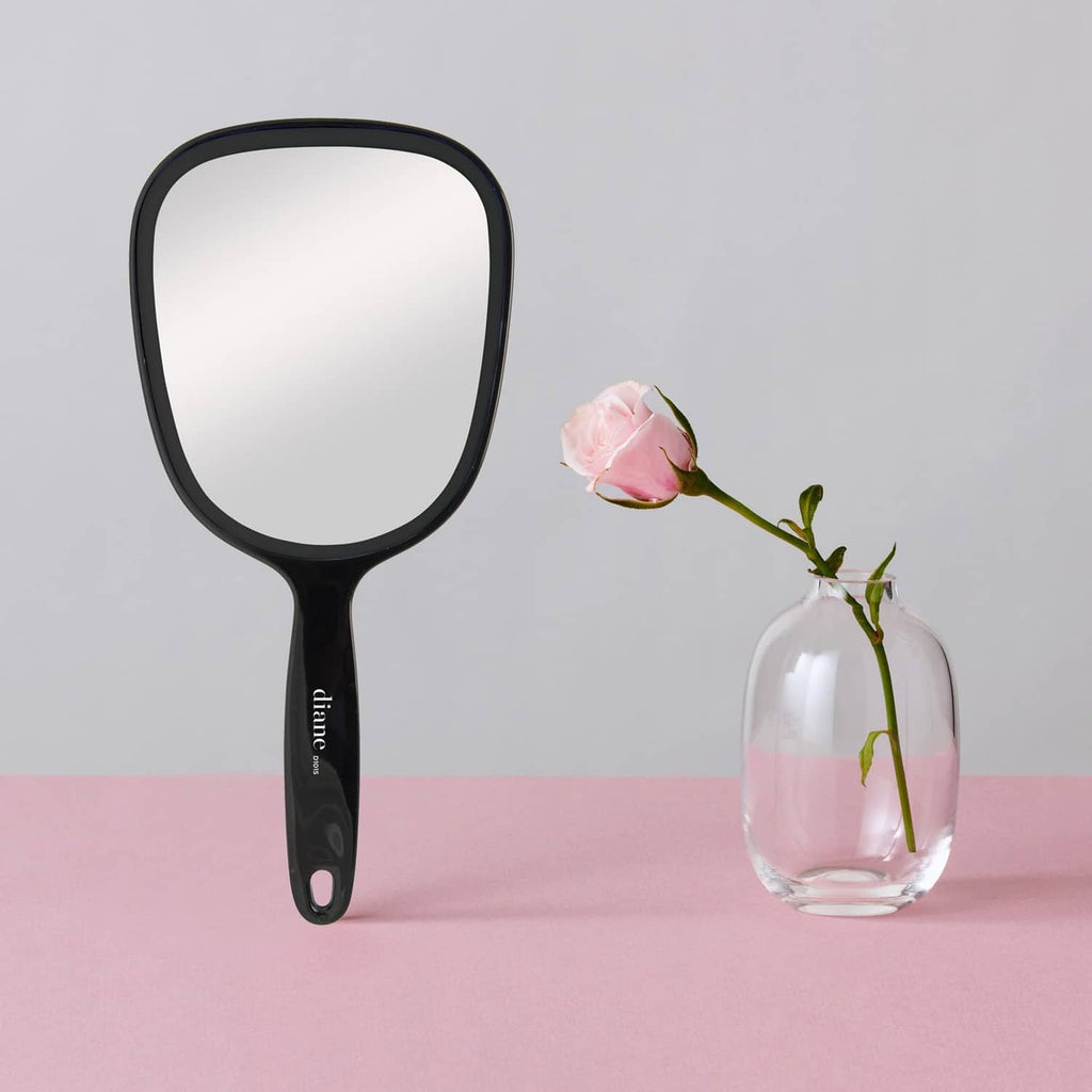 Black single-sided handheld magnifying mirror with glossy oval frame and grip handle