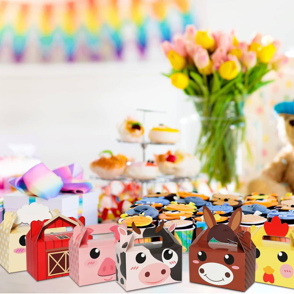Farm animal party favor treat boxes with colorful sprinkles on a table setting