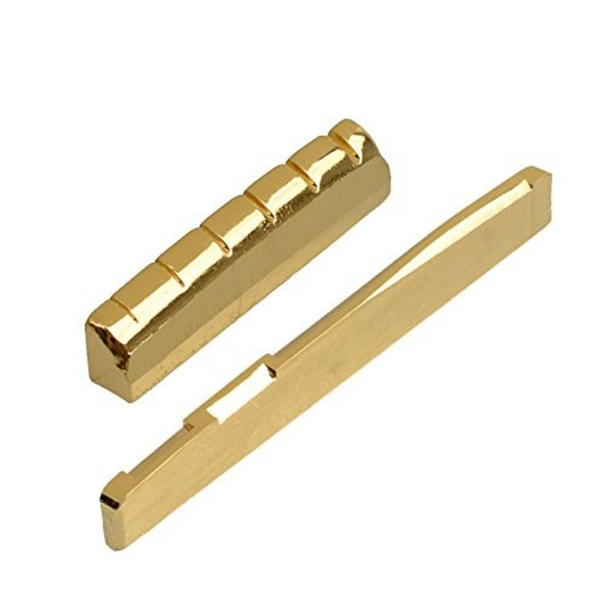 Gold-plated brass acoustic guitar saddle and nut pieces, angled close-up.