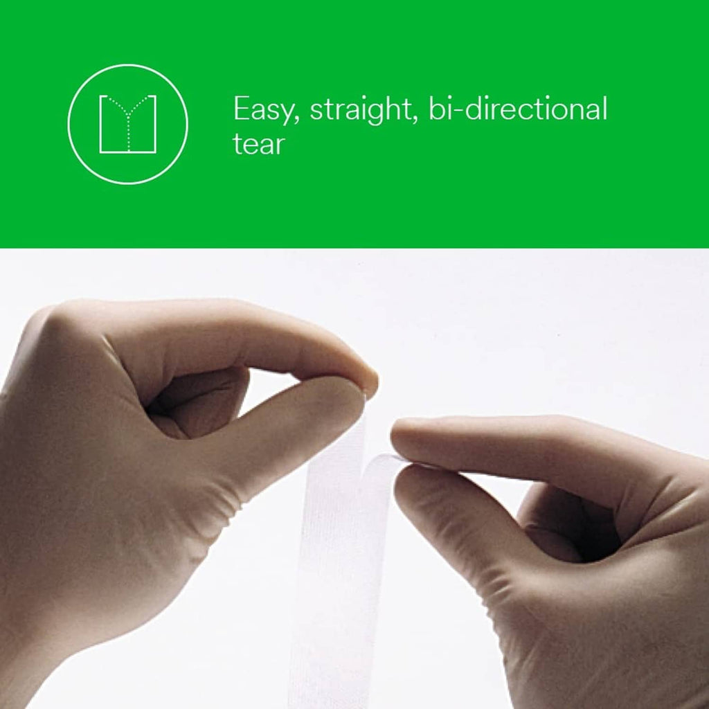 Clear surgical tape strip being torn by gloved hands