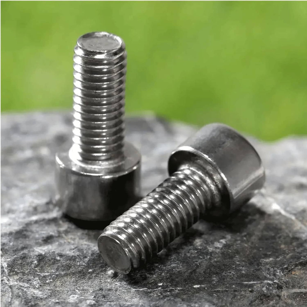 Close-up of threaded silver M5x12mm hex socket cap bolts