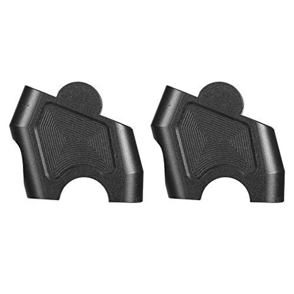 Two black CNC handlebar riser blocks, shown from the side with mounting cutouts