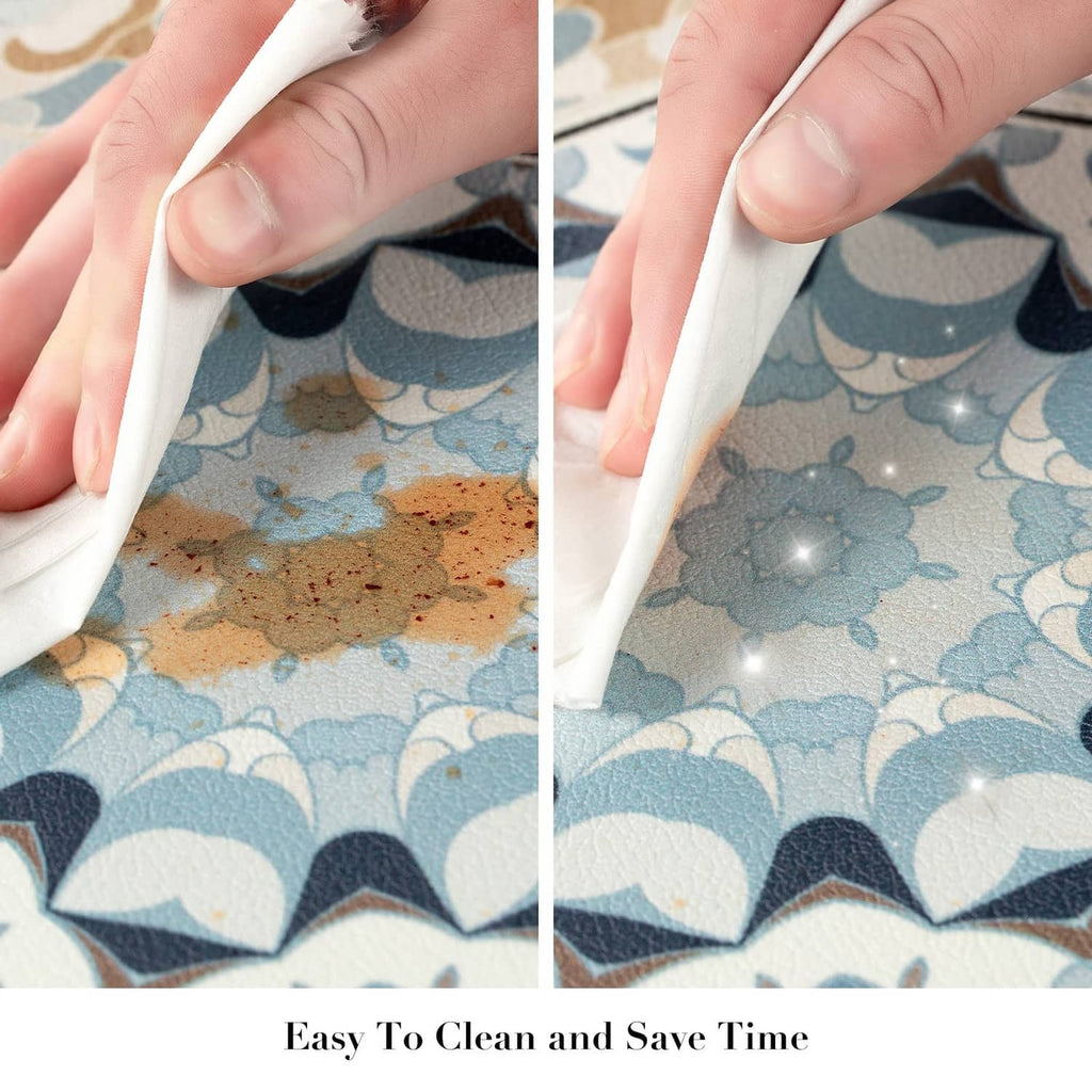 Hand lifting edge of multi-color tile-pattern kitchen rug for easy cleaning