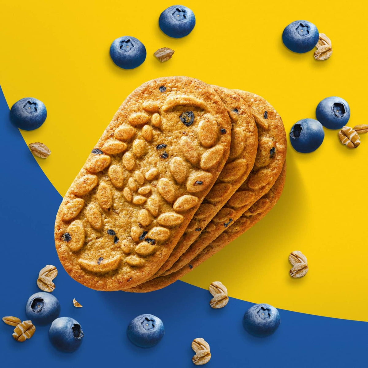 Stack of belVita Crunchy Blueberry breakfast biscuits with blueberries