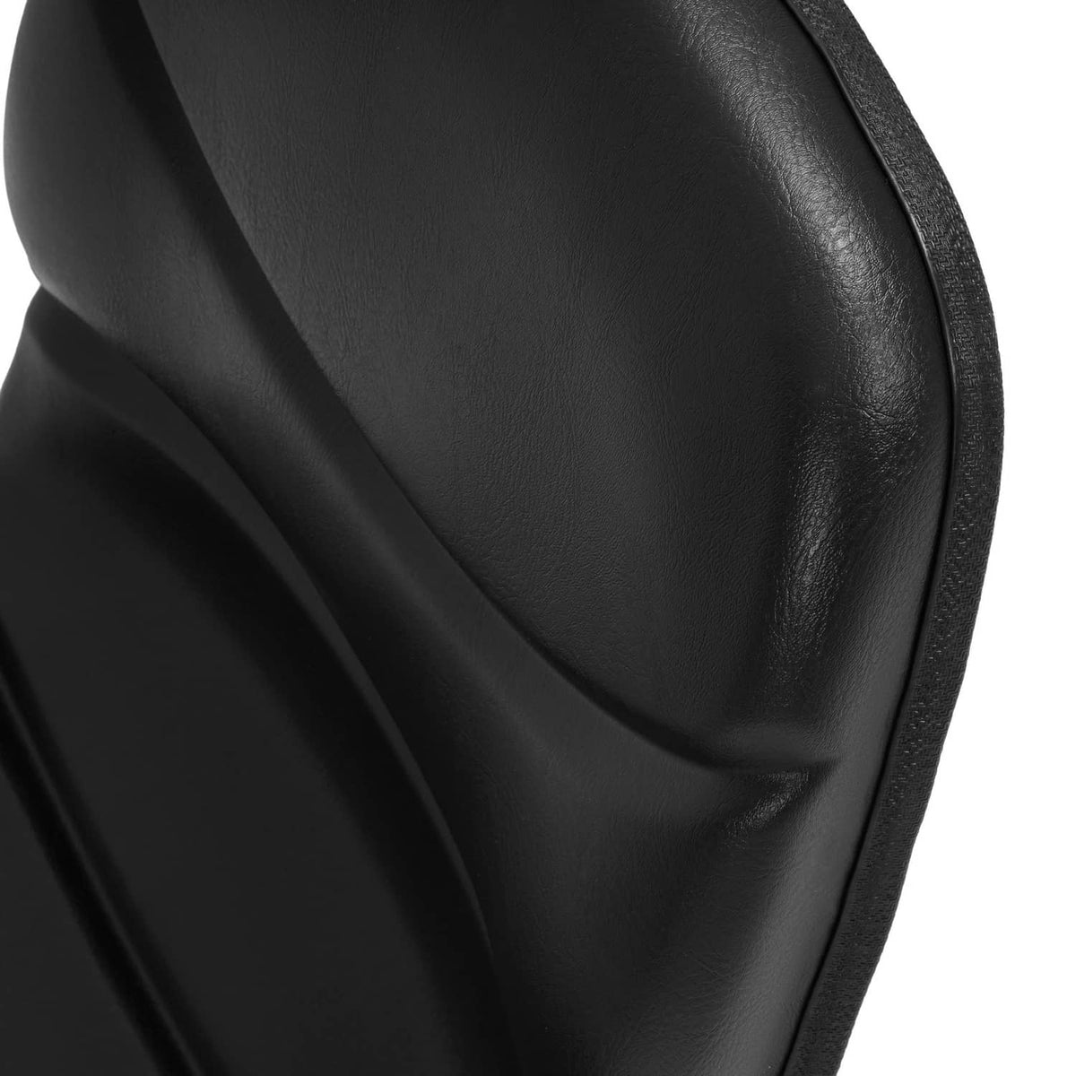 Black padded tractor seat with stitched seam detail and glossy vinyl texture.