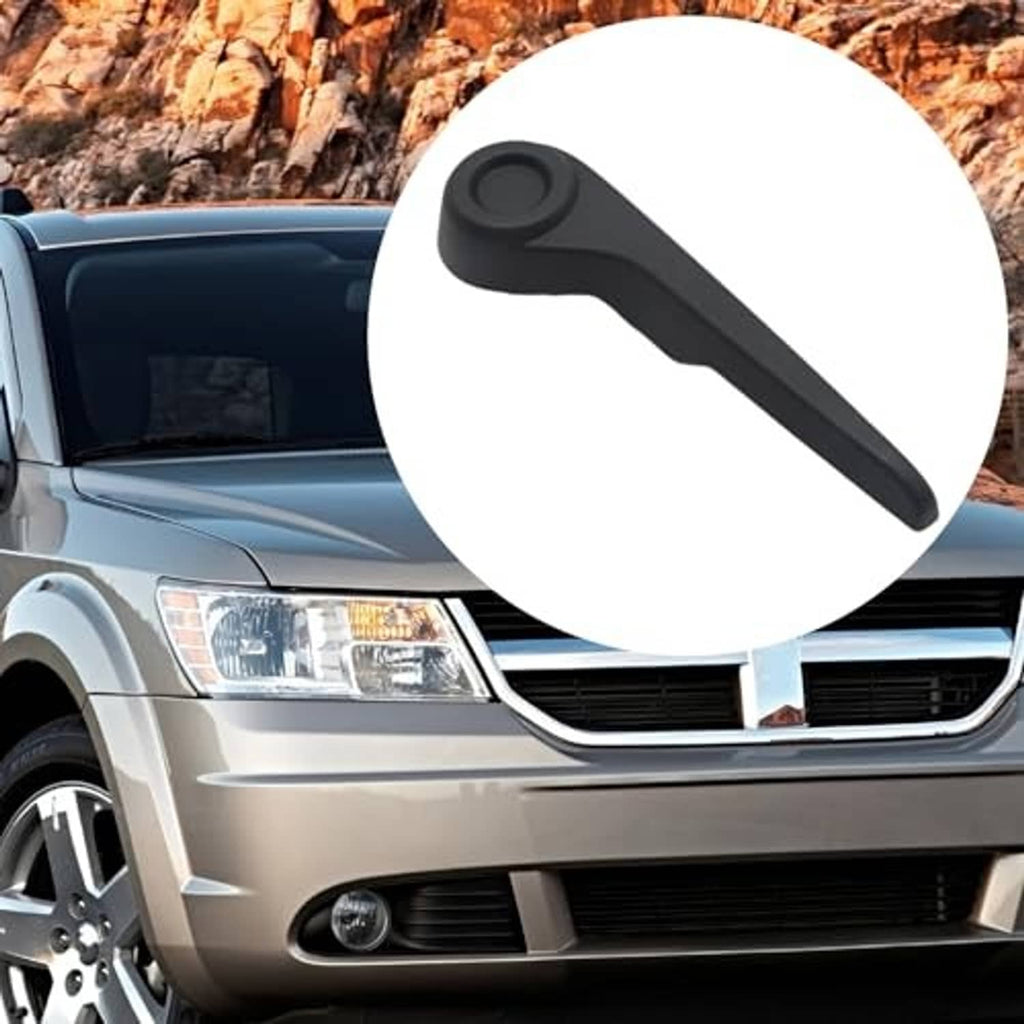 Black recliner handle lever with round button, front passenger side.