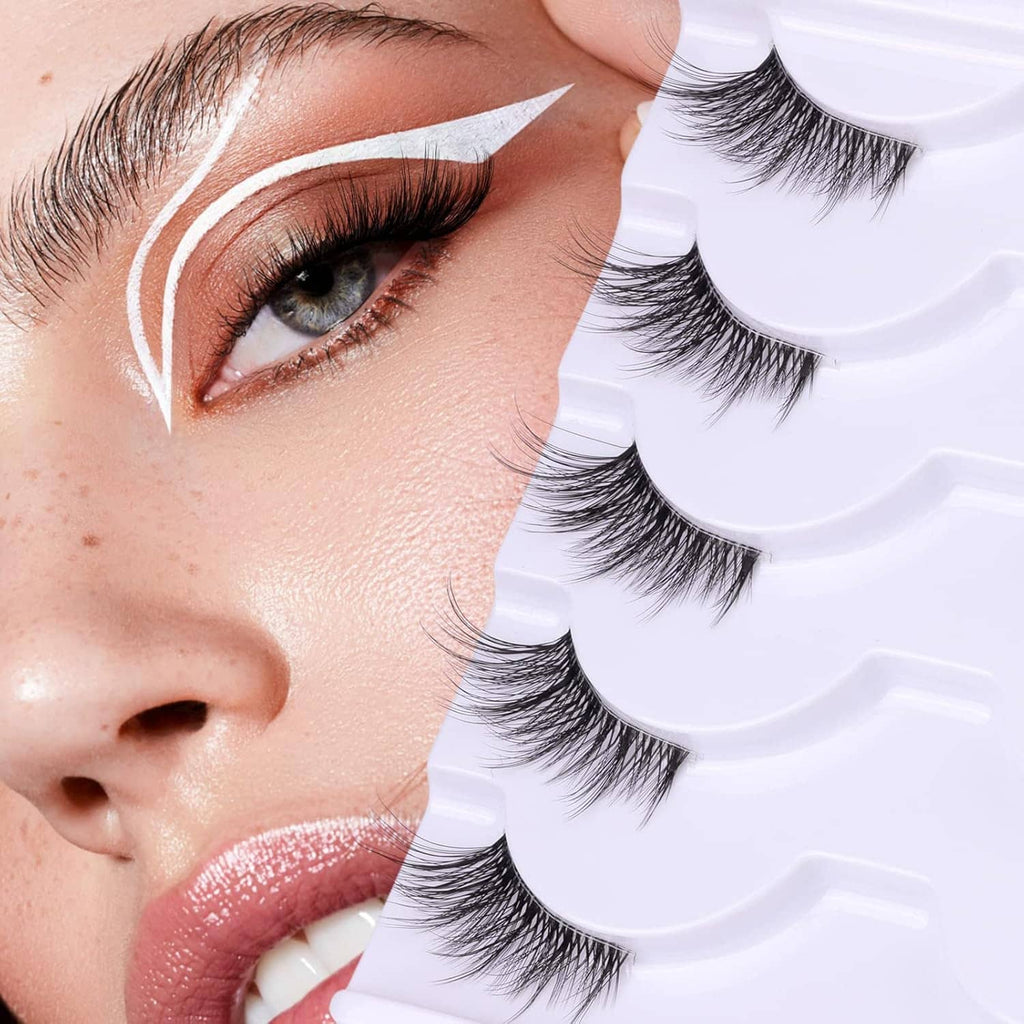Wispy false eyelashes with clear band being applied on an eye, natural look style