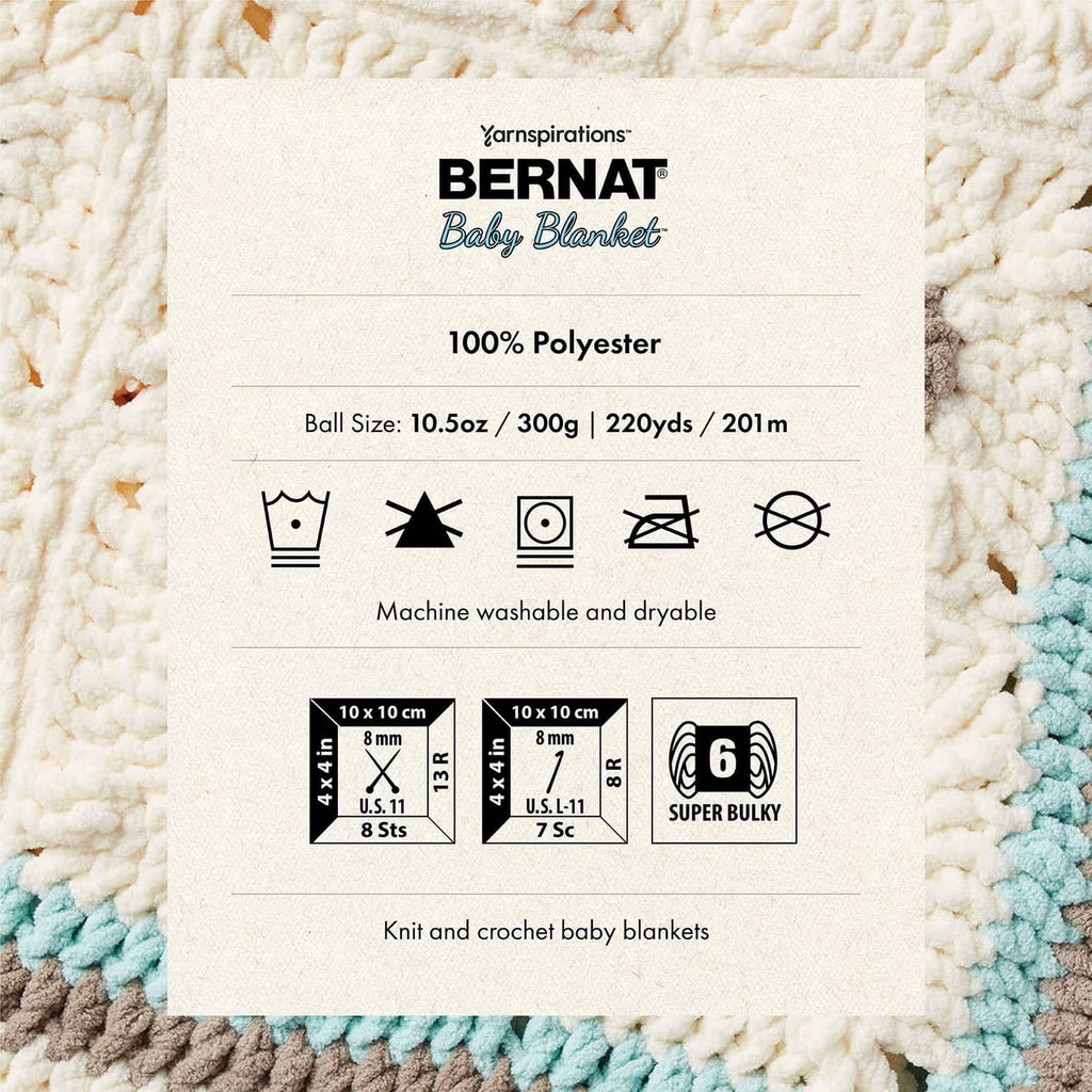 Yarn label card showing 100% polyester on chunky white knit with blue edge