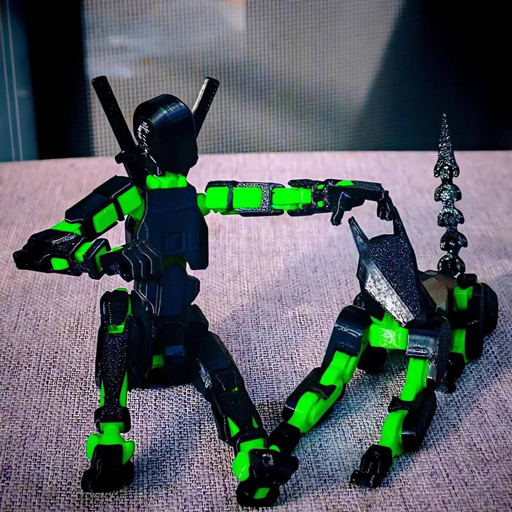 Two dark-and-green robot action figures posed on a tabletop, with sword accessories