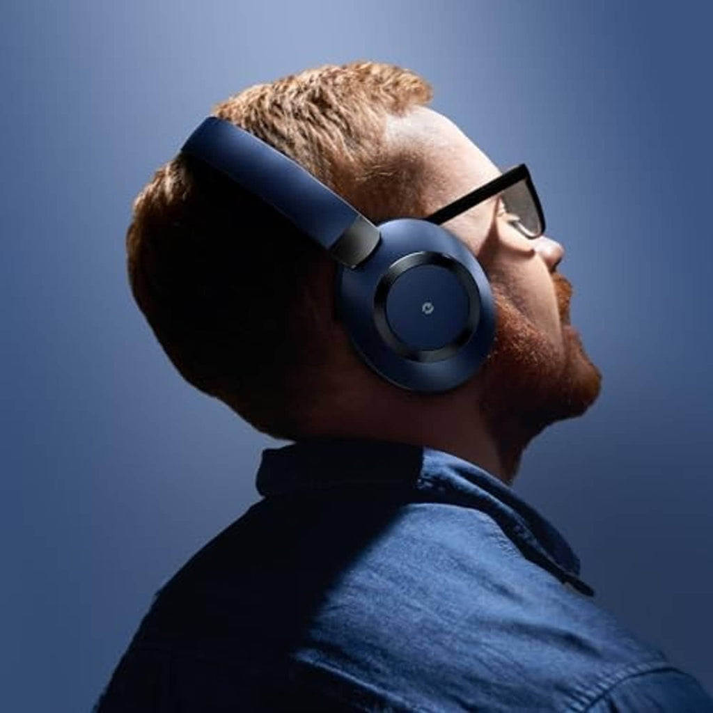Blue over-ear headphones worn by a man with short beard