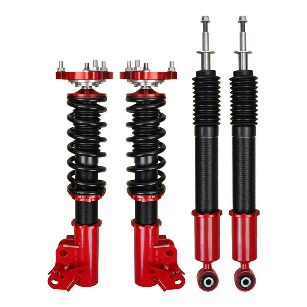 Four-piece suspension set: two black spring coilovers and two black shock struts