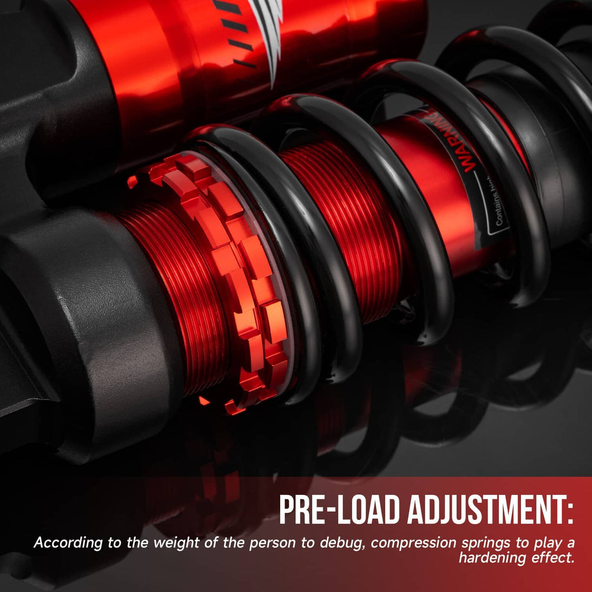 Air shock absorber close-up showing preload adjustment ring on red and black body