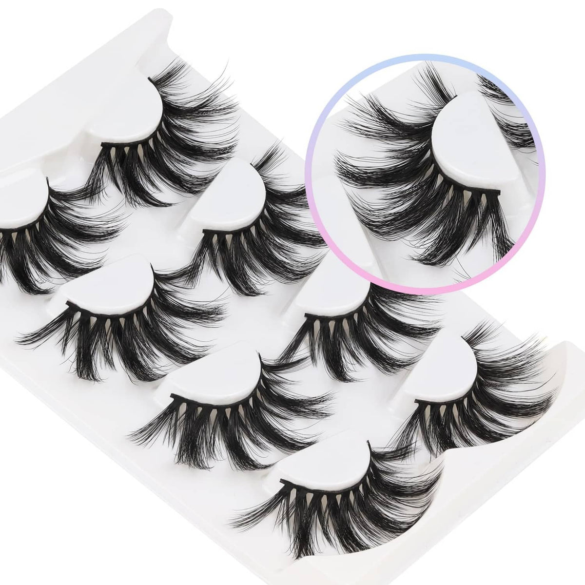 Black faux mink eyelash strips with soft band, multiple lengths fanned on a clear tray