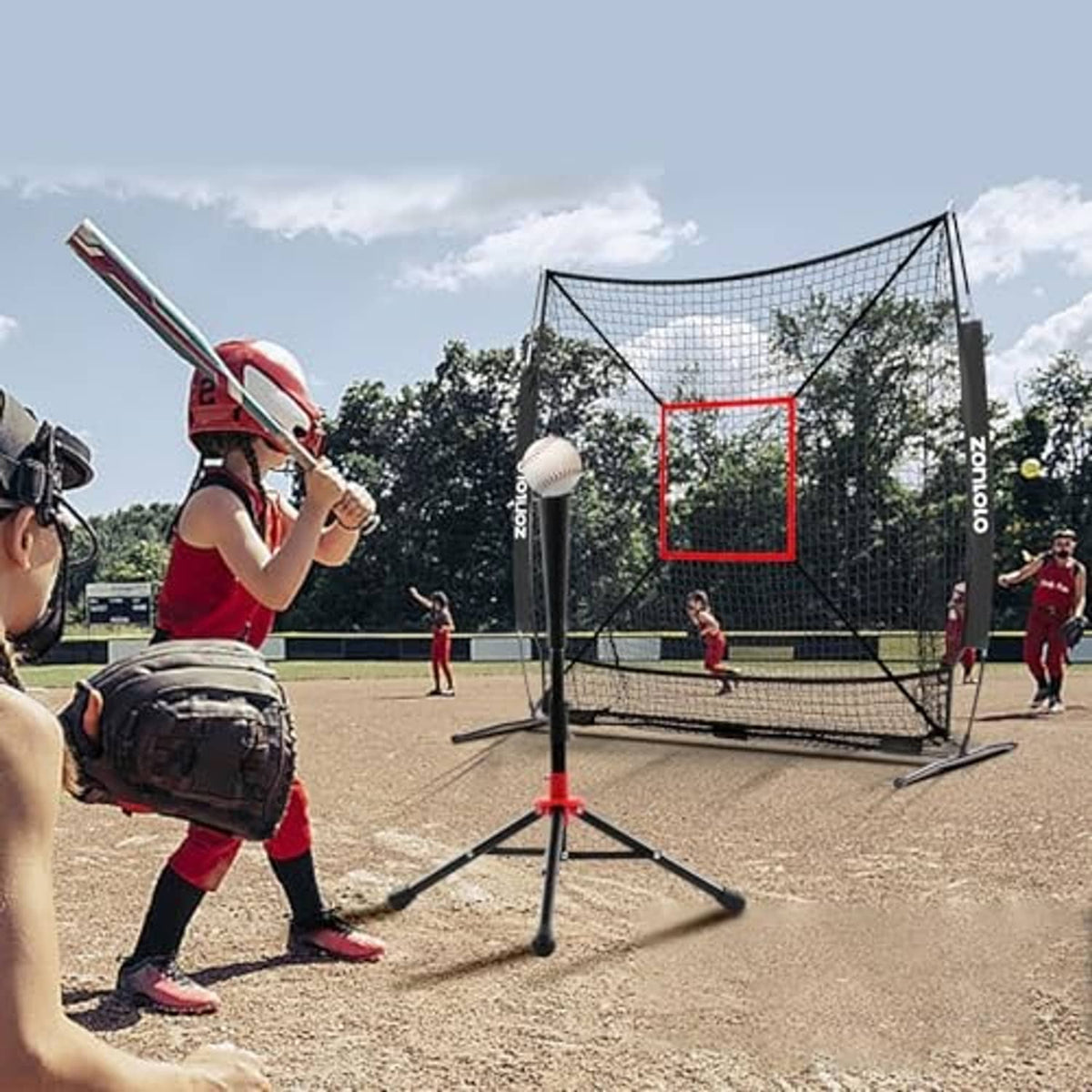 Batting practice net with black frame, white mesh and red square strike target on tripod stand