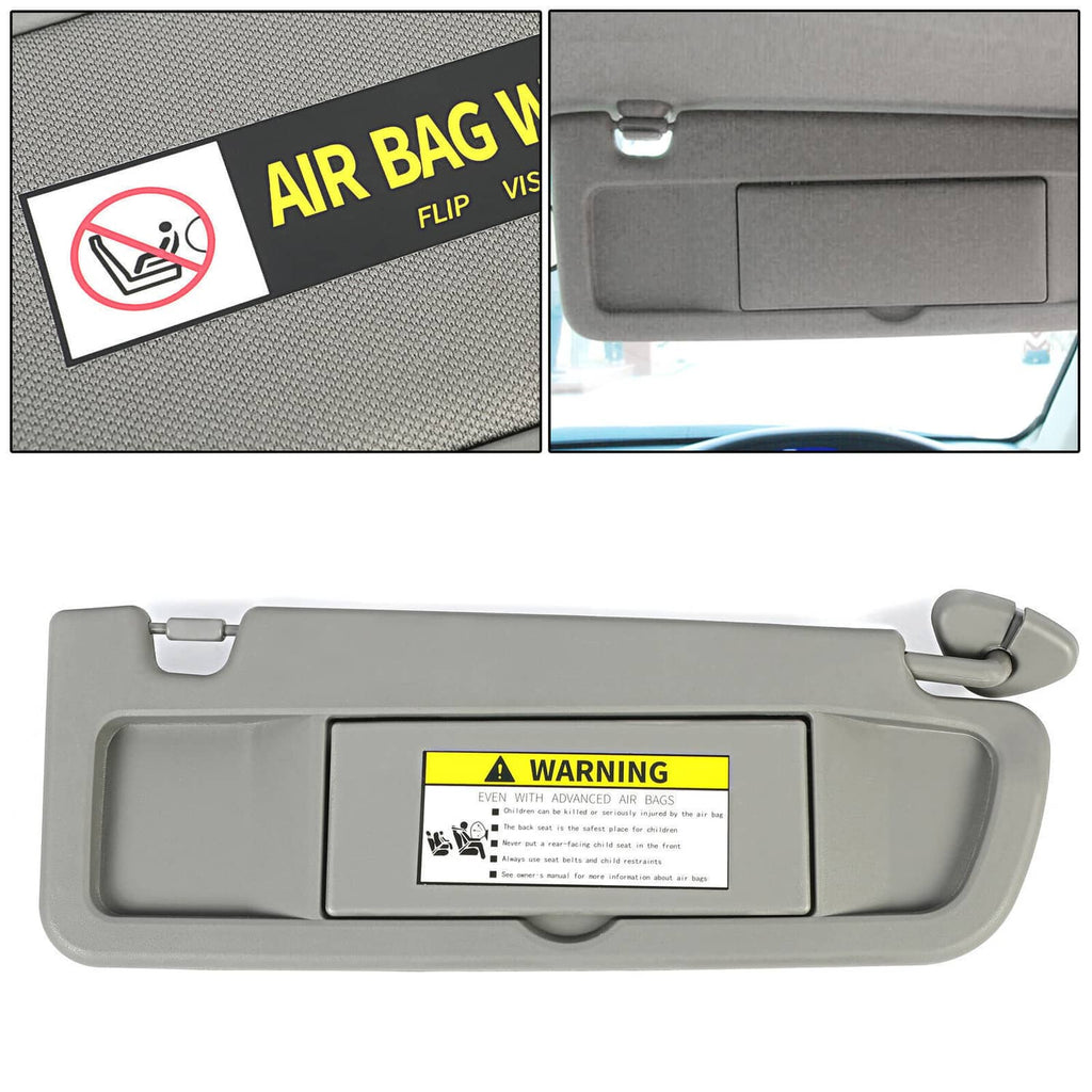 Grey right sun visor with warning label and flip-down shield panel