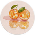 Round orange mouse pad with four disco ball designs and green leaves