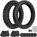 Two black knobby tires with inner tube and round repair patches, set