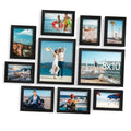 Black picture frames collage wall set with multiple beach and landscape photo inserts
