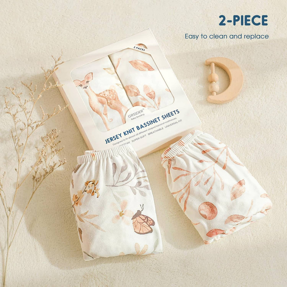 Two-piece fitted bassinet sheet set in blush woodland animal leaf print