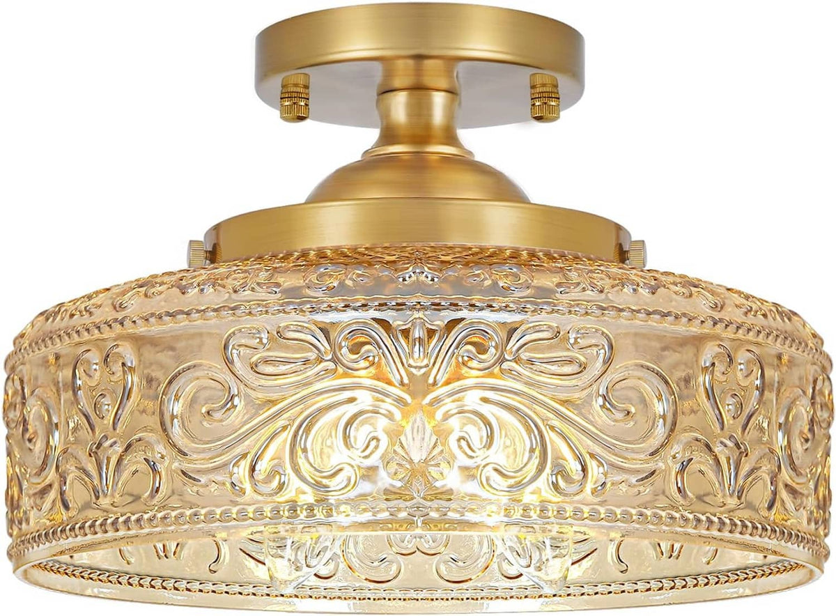 Gold 3-light semi-flush mount ceiling light with embossed amber glass shade and canopy