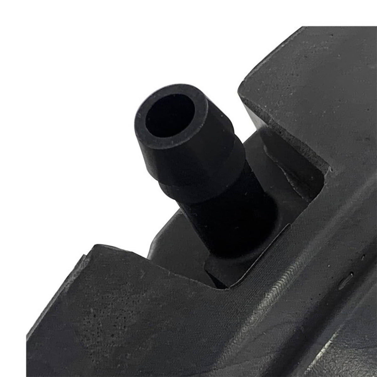 Close-up of black crankcase breather inlet and molded connector port