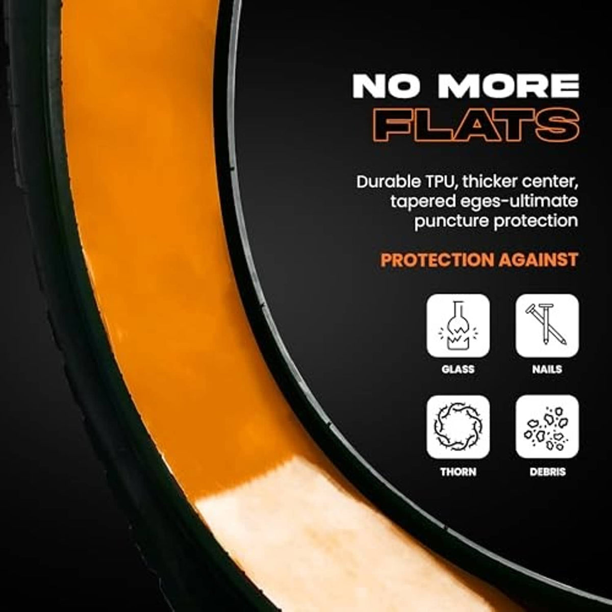 Close-up of orange bike tube liner tucked inside a bike tire sidewall.