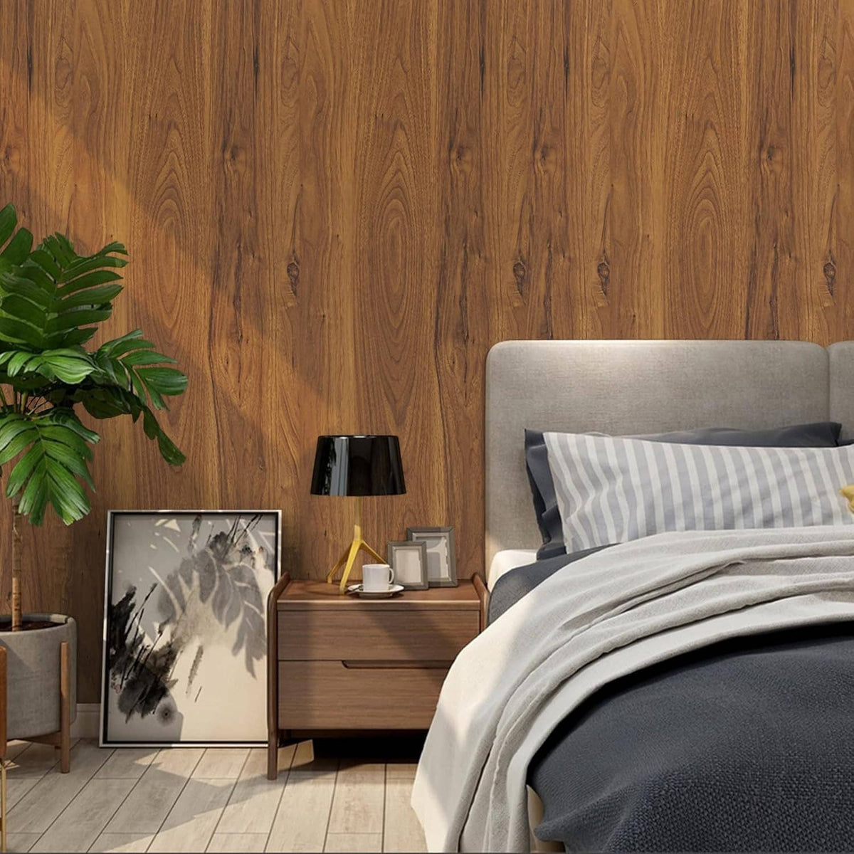 Wood grain contact paper installed as a wall backdrop behind a bed and nightstand