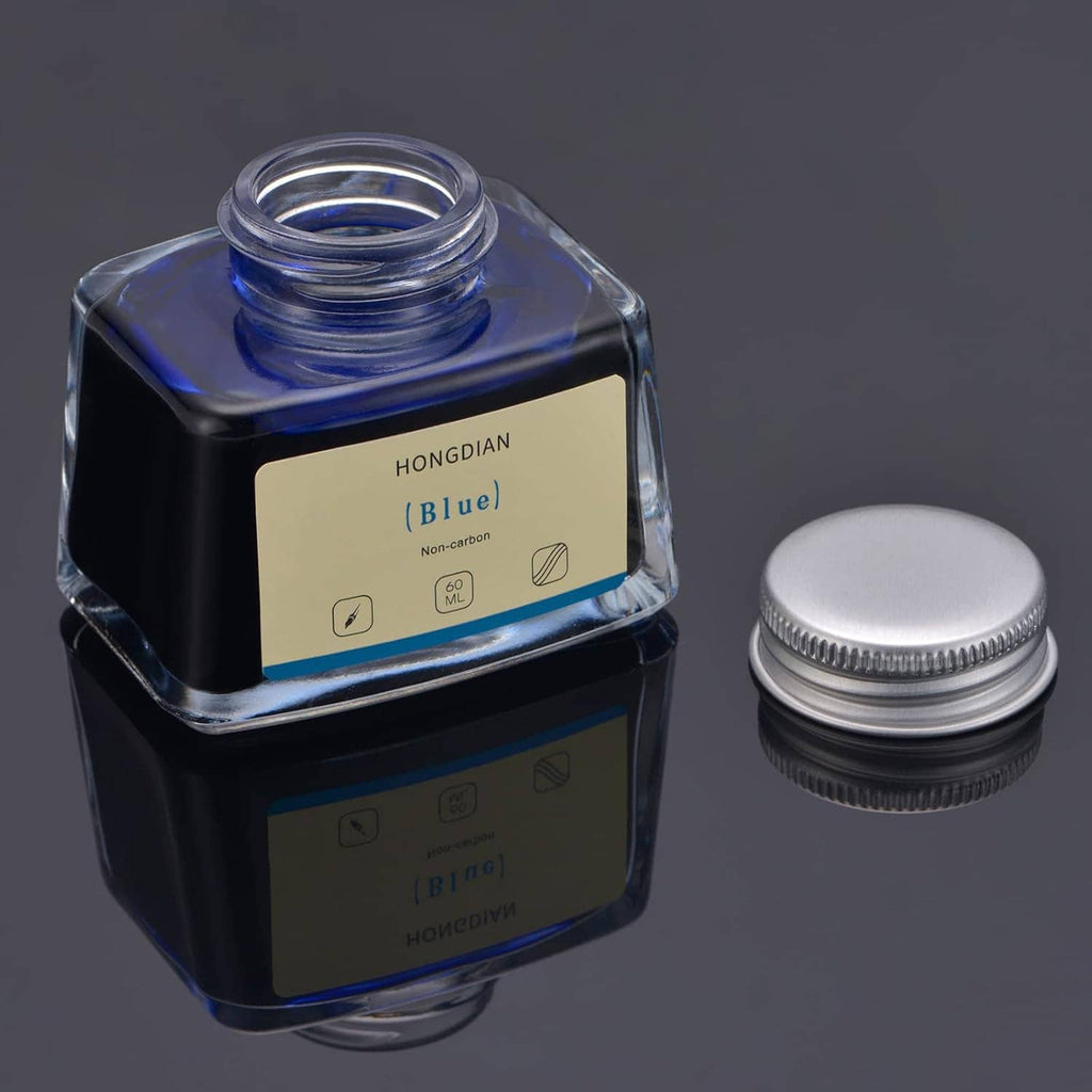 Hongdian Blue 60 ml fountain pen ink bottle with silver cap beside it