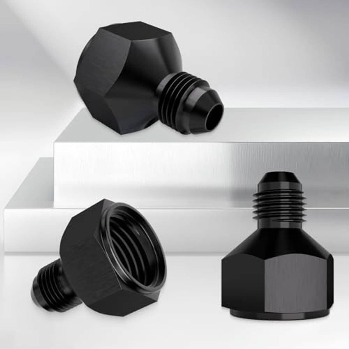 Black AN hose reducer fitting with hex body and threaded male connection ends