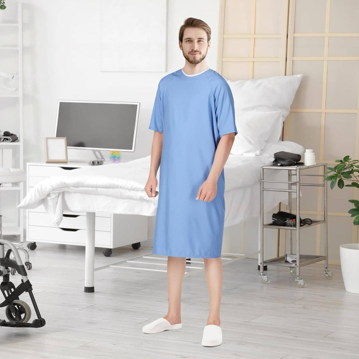 Men's patient hospital gown in light blue, short sleeves and crew neck, model standing